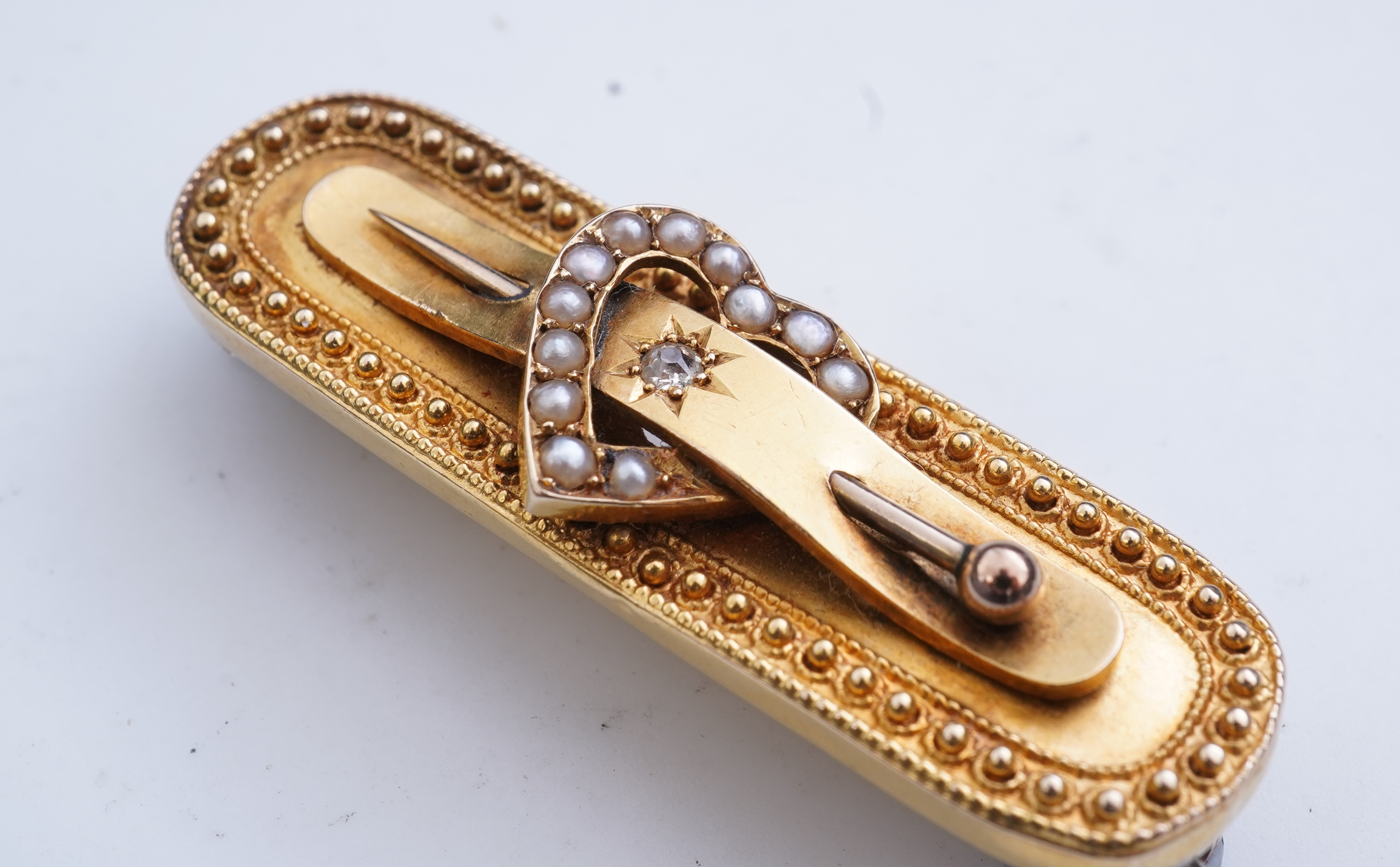 An Edwardian gold and seed pearl brooch, circa 1896
